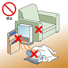 温風暖房機（ファンヒーター）の温風吹出し口やエアフィルターをふさがないでください。異常燃焼したり、火災の原因となります。